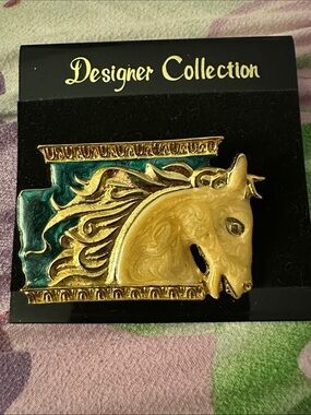 Vintage Designer Collection Gold Horse Head Brooch with Teal Background